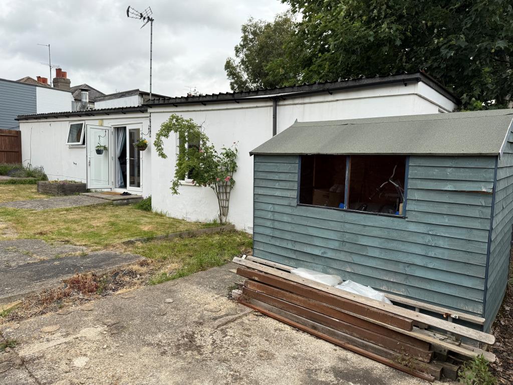 Lot: 161 - DETACHED BUNGALOW IN TOWN CENTRE - Rear elevation with patio area and shed